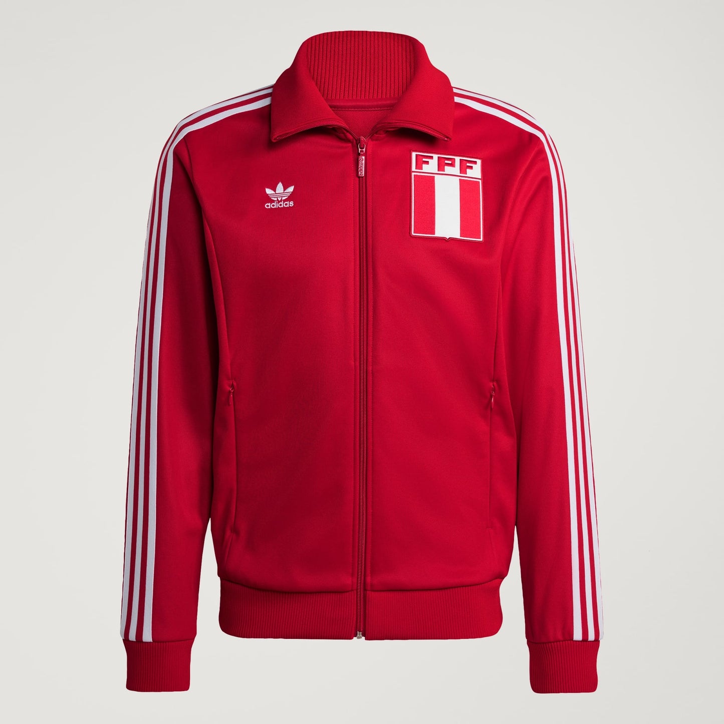 Red jacket with white stripes and Adidas logo on a light gray background