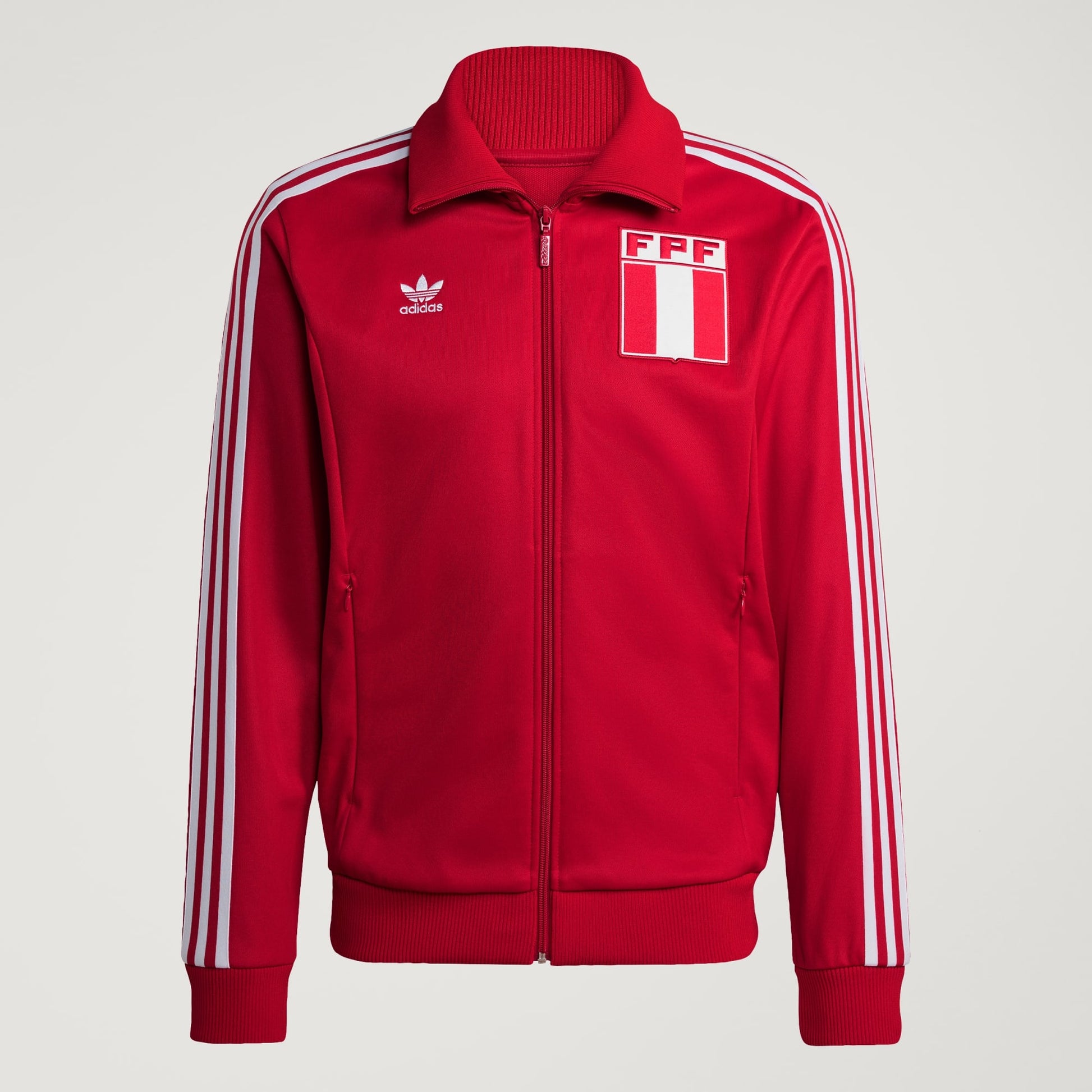 Red jacket with white stripes and Adidas logo on a light gray background