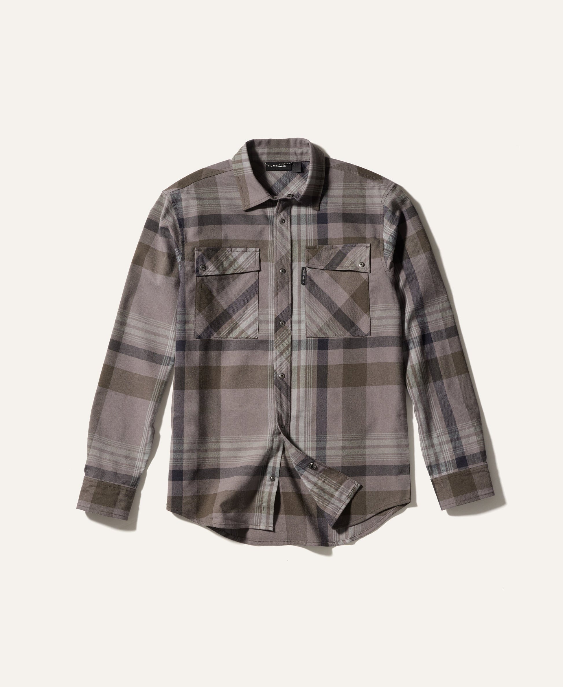 Plaid shirt with a neutral color palette on a light beige background