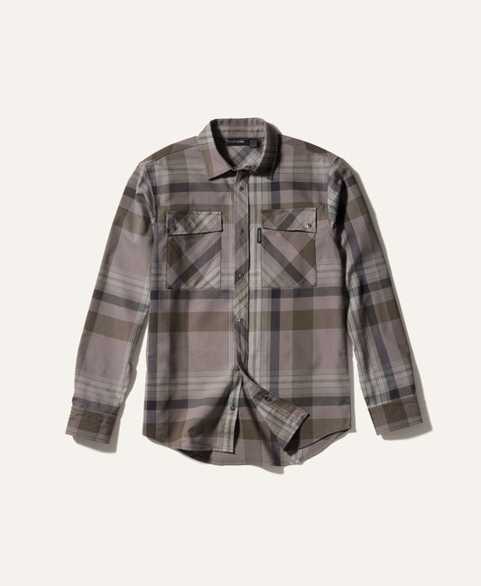 Plaid shirt with a neutral color palette on a light beige background